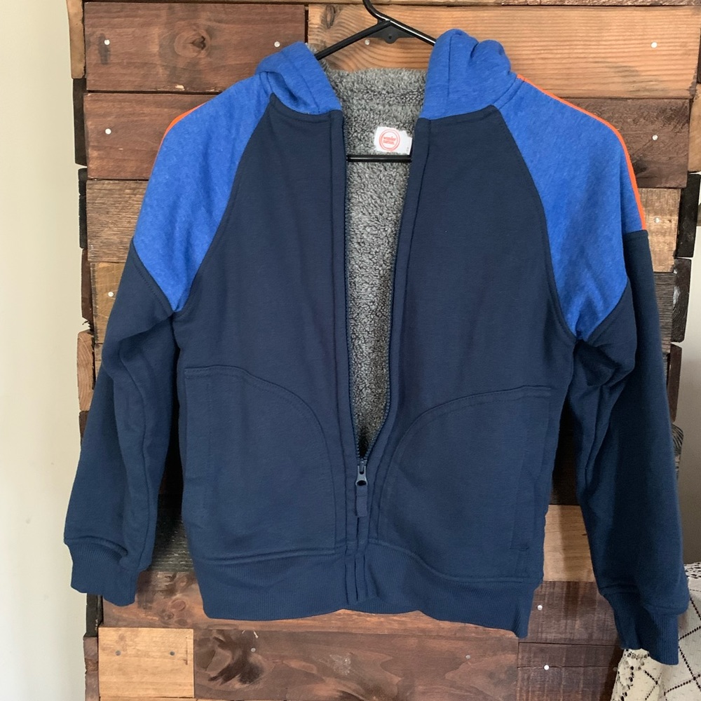 Boys winter coat Never worn. Has built in name tag